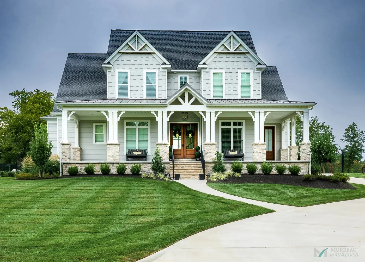 Traditional two-story custom home with wraparound porch and gable detailing, Western Kentucky