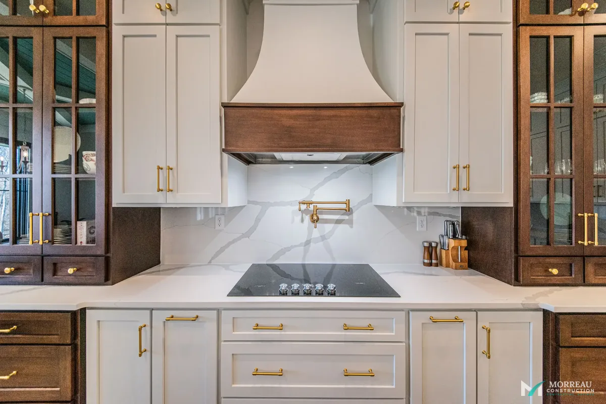 Kitchen with sage green island and copper hood