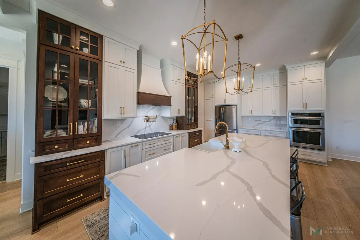 Kitchen with gray island and quartz counters