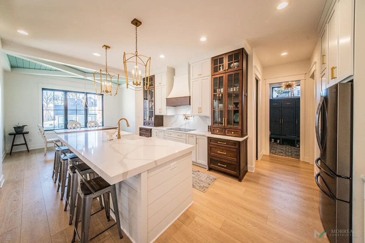 Kitchen with green island and custom cabinetry