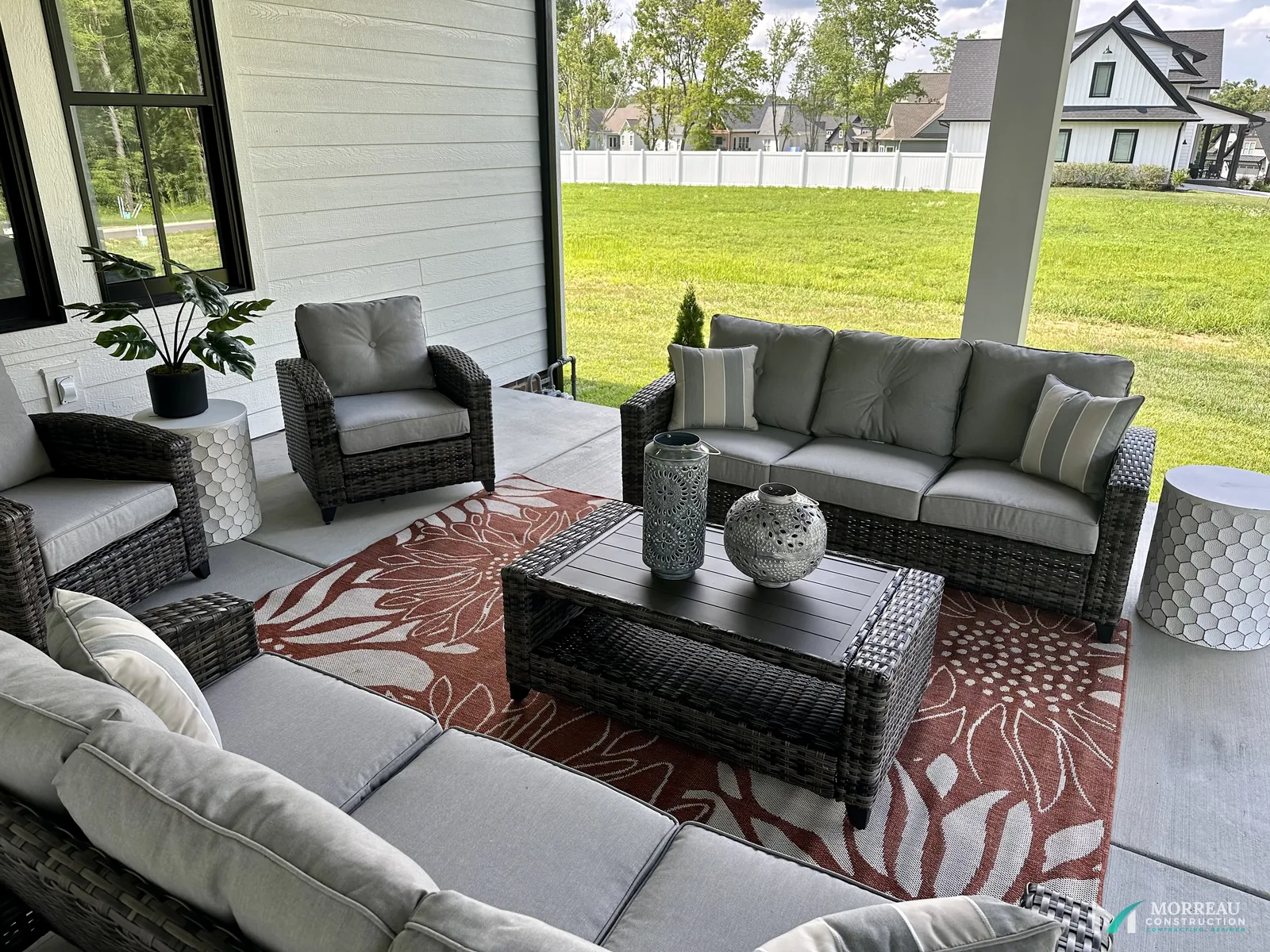 Covered outdoor living space with seating